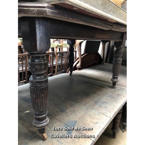 92 - RECTANGULAR DINING TABLE ON CASTORS, IN NEED OF RESTORATION, 51 X 40 X 27.5 INCHES / LOCATED AT VICT... 