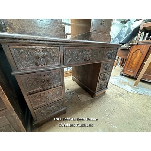 1 - OAK CARVED DESK WITH NINE DRAWERS, 41.5 X 28.5 X 29.5 INCHES / LOCATED AT VICTORIA ANTIQUES, WADEBRI... 