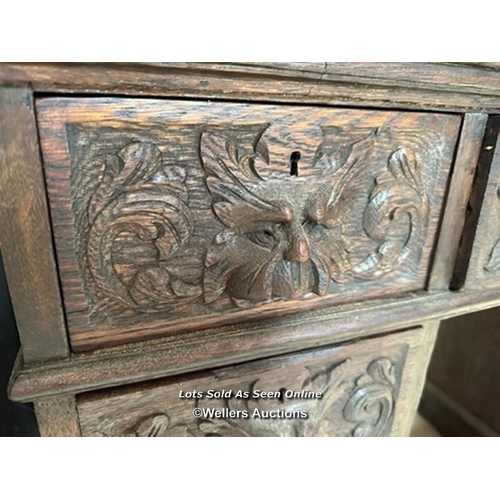 1 - OAK CARVED DESK WITH NINE DRAWERS, 41.5 X 28.5 X 29.5 INCHES / LOCATED AT VICTORIA ANTIQUES, WADEBRI... 