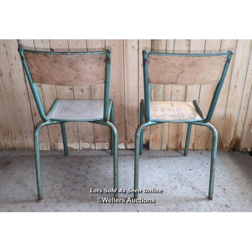 1 - Two vintage school chairs. Stackable tubular frames with ply seat