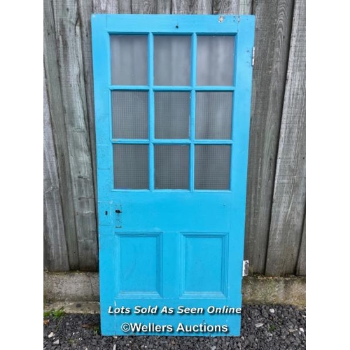 120 - Reclaimed pine school door with 9 glazed panels, 6 of them with wired safety glass. 92cm x 200cm x 4... 