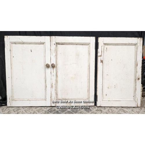 125 - Pair glazed cupboard doors and three solid cupboard doors. All pine. One piece of glass missing. Pai... 