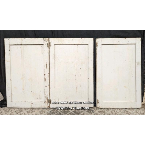 125 - Pair glazed cupboard doors and three solid cupboard doors. All pine. One piece of glass missing. Pai... 