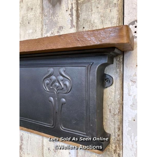 131 - Art Nouveau cast iron fireplace element converted into wall shelf with oak top. 110cm x 37cm T.