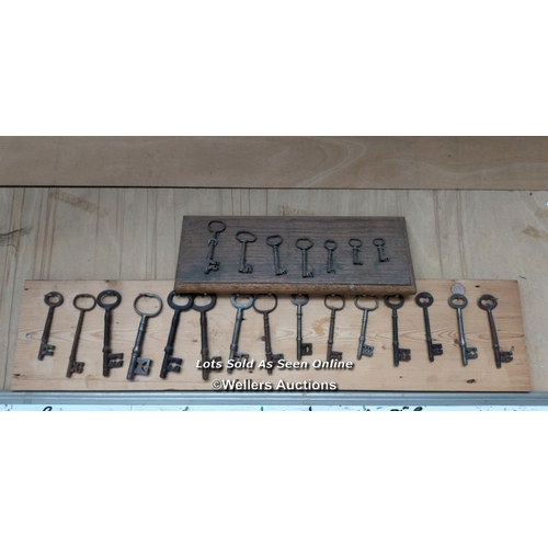 140 - 2 decorative boards with old keys hanging on them