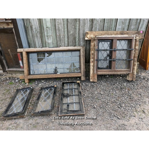 148 - Batch of 5 reclaimed windows, two in oak surrounds. 3 opening cast iron ones