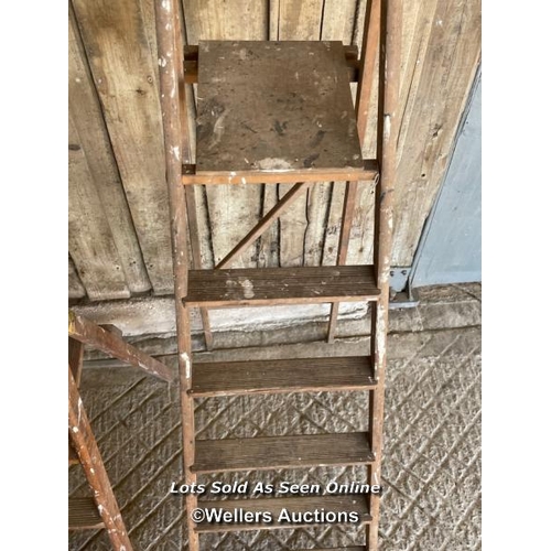 156 - 3 ladders. 2 wooden step ladders and a timber straight ladder 294cm tall