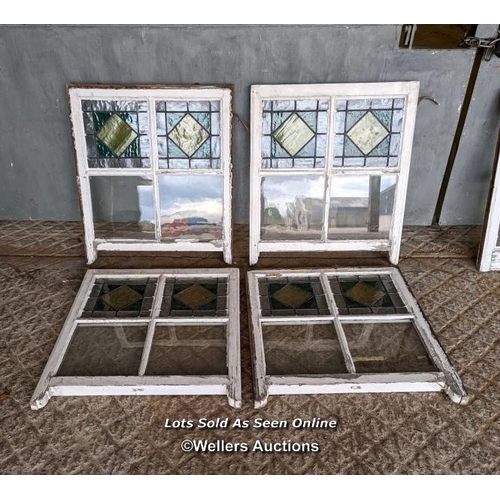 18 - 9 stained glass panels in pine frames from a sash window. Some breaks in the glass. Approx size each... 