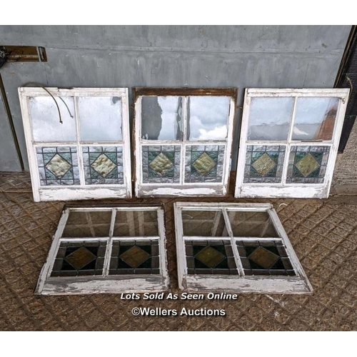 18 - 9 stained glass panels in pine frames from a sash window. Some breaks in the glass. Approx size each... 