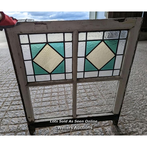 18 - 9 stained glass panels in pine frames from a sash window. Some breaks in the glass. Approx size each... 