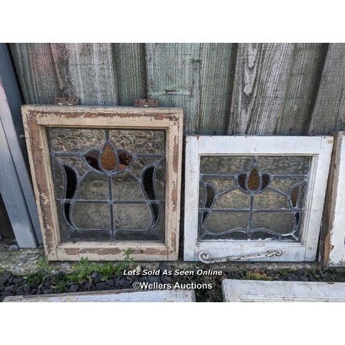 4 - 9 stained glass panels in pine frames. 2 frames missing one side. For restoration. Some breaks in th... 