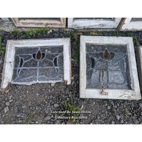 4 - 9 stained glass panels in pine frames. 2 frames missing one side. For restoration. Some breaks in th... 