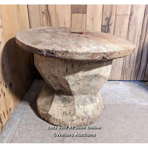 48 - A very large grain mortar. West African. Hardwood. The lid (75cm across) had a hole, now patched in ... 