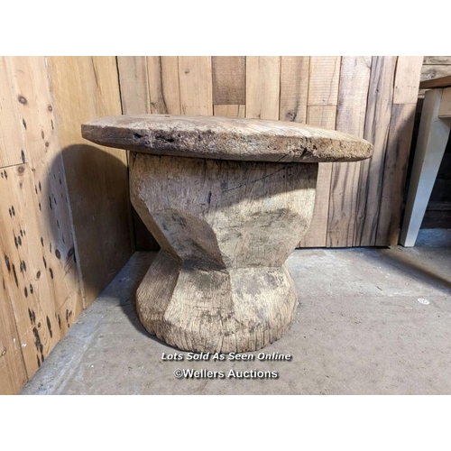 48 - A very large grain mortar. West African. Hardwood. The lid (75cm across) had a hole, now patched in ... 