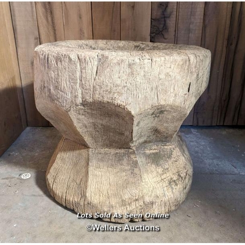 48 - A very large grain mortar. West African. Hardwood. The lid (75cm across) had a hole, now patched in ... 