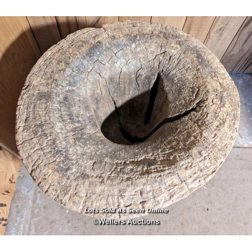 48 - A very large grain mortar. West African. Hardwood. The lid (75cm across) had a hole, now patched in ... 