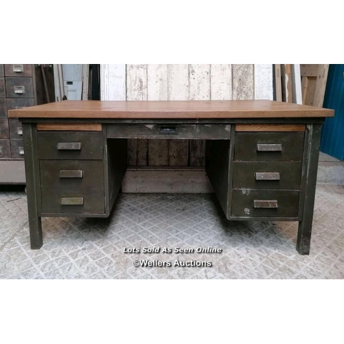 49 - A vintage metal knee hole desk with later oak top. 157cm W x 76cm H x 89cm D. Some marks, ex shop di... 