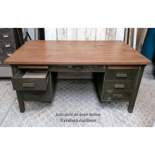 49 - A vintage metal knee hole desk with later oak top. 157cm W x 76cm H x 89cm D. Some marks, ex shop di... 