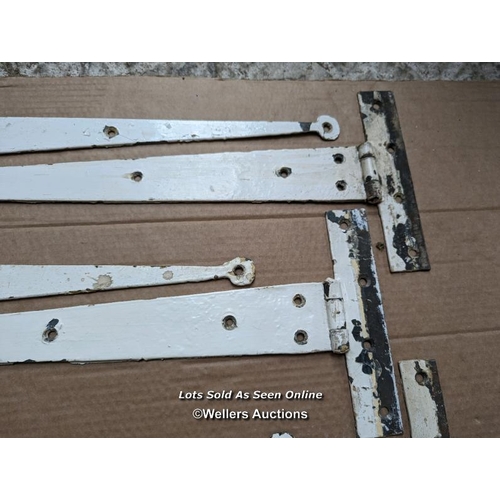 54 - 7 Victorian metal strap hinges. Approx 65cm long. Tapered with 'penny' ends