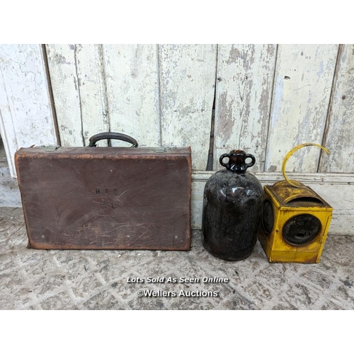 67 - Mixed lot. Old suitcase, road lamp and demi john