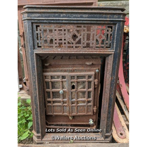 77 - An Art Deco woodburning stove for restoration. Outer decorative removable frame in cast iron.  85cm ... 