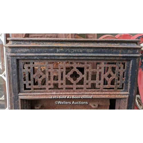 77 - An Art Deco woodburning stove for restoration. Outer decorative removable frame in cast iron.  85cm ... 