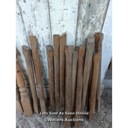 90 - Batch of 16 oak spindles with carved Gothic detail 70 to 80cm long plus pine newel post and three pi... 