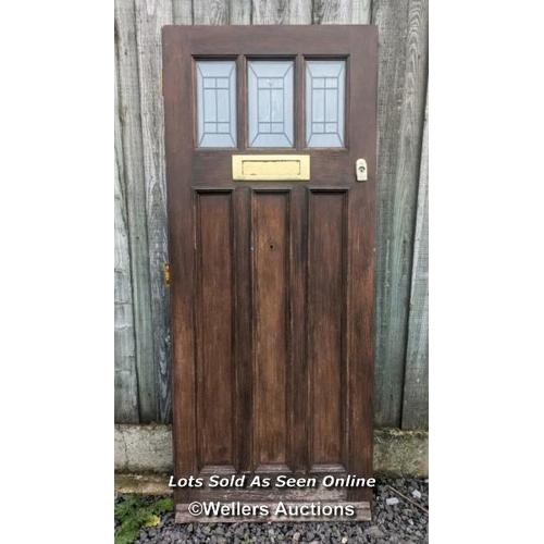 94 - Cottage style modern oak veneered front door. Nice looking door but would need to be in a covered pl... 