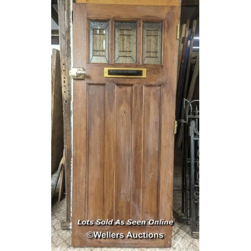 94 - Cottage style modern oak veneered front door. Nice looking door but would need to be in a covered pl... 