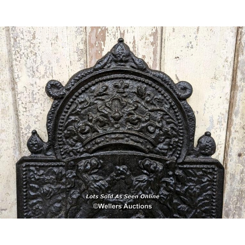 204 - Reclaimed cast iron fire back, european design.  48cm W x 74cm H, thickness 2cm