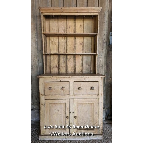 251 - Stripped pine Victorian dresser for restoration. Open shelf over two drawers and two cupboards. 111c... 