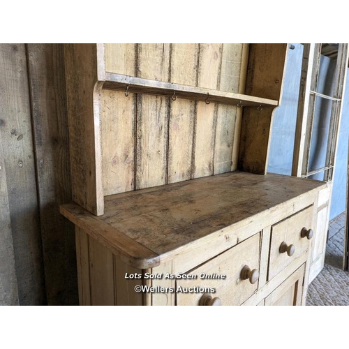 251 - Stripped pine Victorian dresser for restoration. Open shelf over two drawers and two cupboards. 111c... 