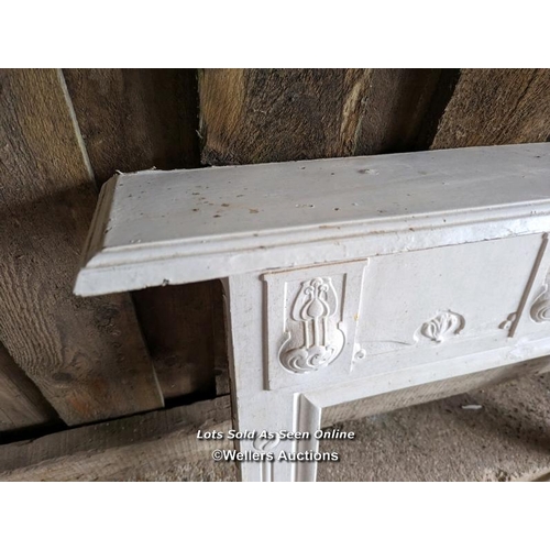 254 - Art Nouveau cast iron fireplace surround. Painted white C1910. Mantel width 111cm. Body width 91.5cm... 