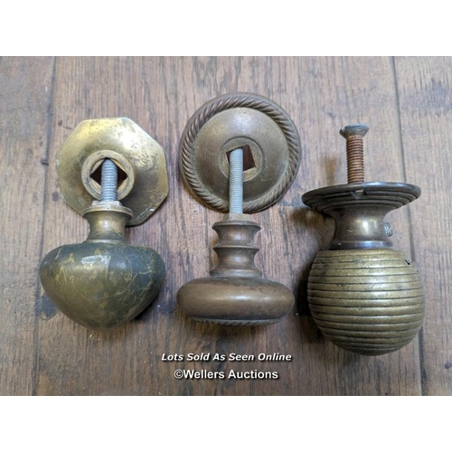 256 - 3 reclaimed brass front door pulls with holding bolts. Beehive pull with wear and tear.