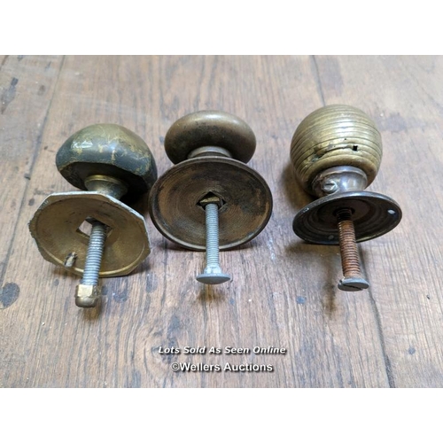 256 - 3 reclaimed brass front door pulls with holding bolts. Beehive pull with wear and tear.