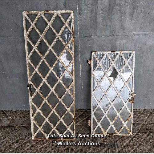 259 - A pair of Victorian diamond cast iron windows for restoration. No frames. Sizes 41cm x 114cm and 38c... 