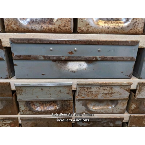 278 - Set of industrial metal drawers for restoration. 21 drawers. Overall size 91cm W x 43cm H x 30cm D