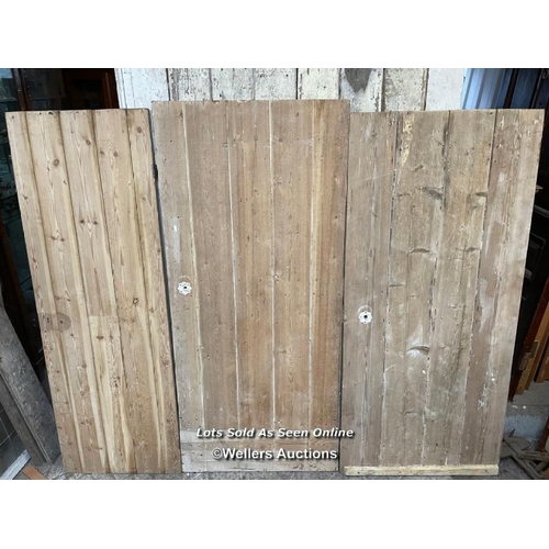 281 - 3 stripped pine plank cottage style doors. Sizes 60cm x 173cm. 79cm x 177cm. 79cm x 171cm