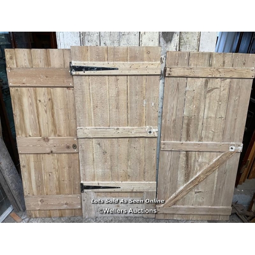 281 - 3 stripped pine plank cottage style doors. Sizes 60cm x 173cm. 79cm x 177cm. 79cm x 171cm