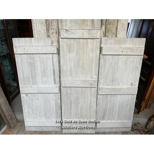 282 - 3 painted pine planked cupboard doors. Sizes 2 at 67.5cm x 167cm. 1 at 60cm x 196cm