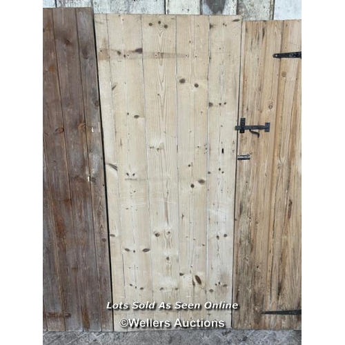 283 - 3 stripped pine plank cottage style doors. Sizes 72cm x 182cm. 70cm x 179cm. 67cm by 176cm