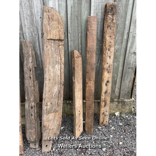 286 - 10 oak reclaimed oak beams. Some with joint cut outs, notches, chips, splits etc. average length 130... 