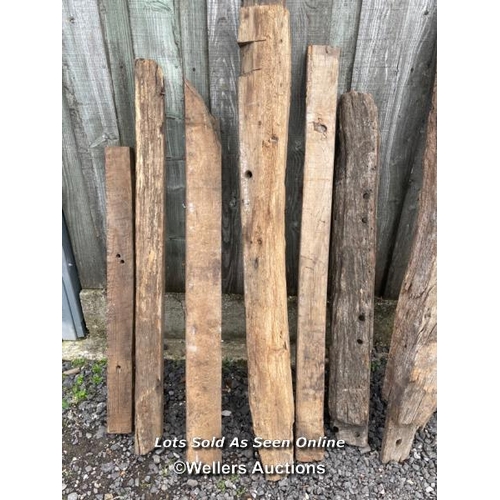 286 - 10 oak reclaimed oak beams. Some with joint cut outs, notches, chips, splits etc. average length 130... 