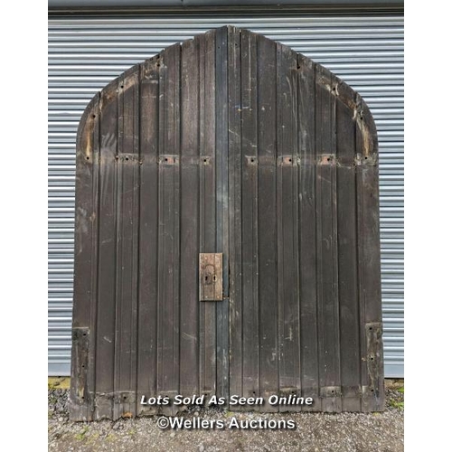 291 - Pair of oak doors needing some restoration from Chichester Cathedral. 197cm W x 247cm H x 5cm thick.... 