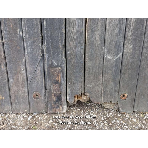 291 - Pair of oak doors needing some restoration from Chichester Cathedral. 197cm W x 247cm H x 5cm thick.... 