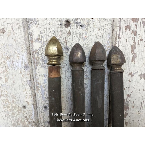 297 - 4 brass curtain poles with gothic style finials to each end. 4 at 133cm long and 1 at 221cm. Plus 5 ... 