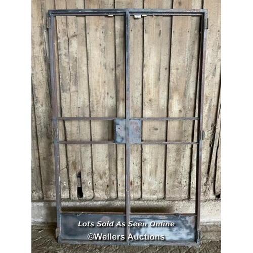 299 - A pair of steel crittall doors, bare metal. C1930. no glass. Each door 64cm x 197cm, No frame