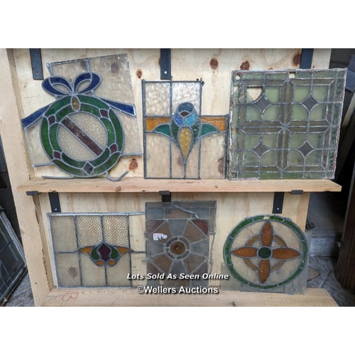 302 - 10 leaded stained glass panels in need of restoration. Some breaks in glass and lead missing.