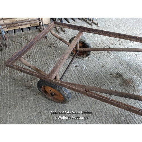 317 - Vintage trolley on wheels with solid rubber tyres. All wheels turning, front axle. Angle iron frame ... 