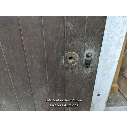 323 - An oak and pine Church door from a Church in Ventnor on the Isle of Wight. 81cm x 230cm x 5cm thick.... 